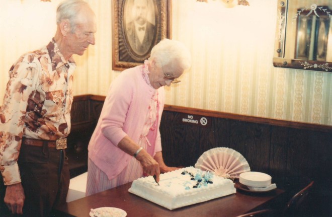 Cutting the cake at their 60th anniversary party
